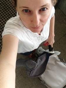 A white top, denim skirt, comfy shoes and umbrella stroller combine to complete my "I'm just an innocent mother with no time to properly groom my eyebrows" impression.