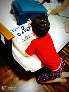 Fig 4: By midday, P had progressed to reading in his pyjamas as T jumped naked on the bed.